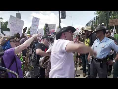 Musicians surround Proud Boys, drown them out with tubas at 'No Kings' protest in Atlanta